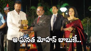 Mohan Babu receiving the West Bengal Governor’s Award of Excellence during an official ceremony, with dignitaries present on stage.