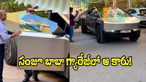 A man believed to be Bollywood actor Sanjay Dutt inspecting a Tesla Cybertruck on a Mumbai street