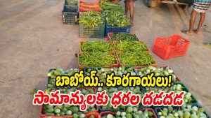 People buying vegetables in a local market in Gadwal as prices continue to rise